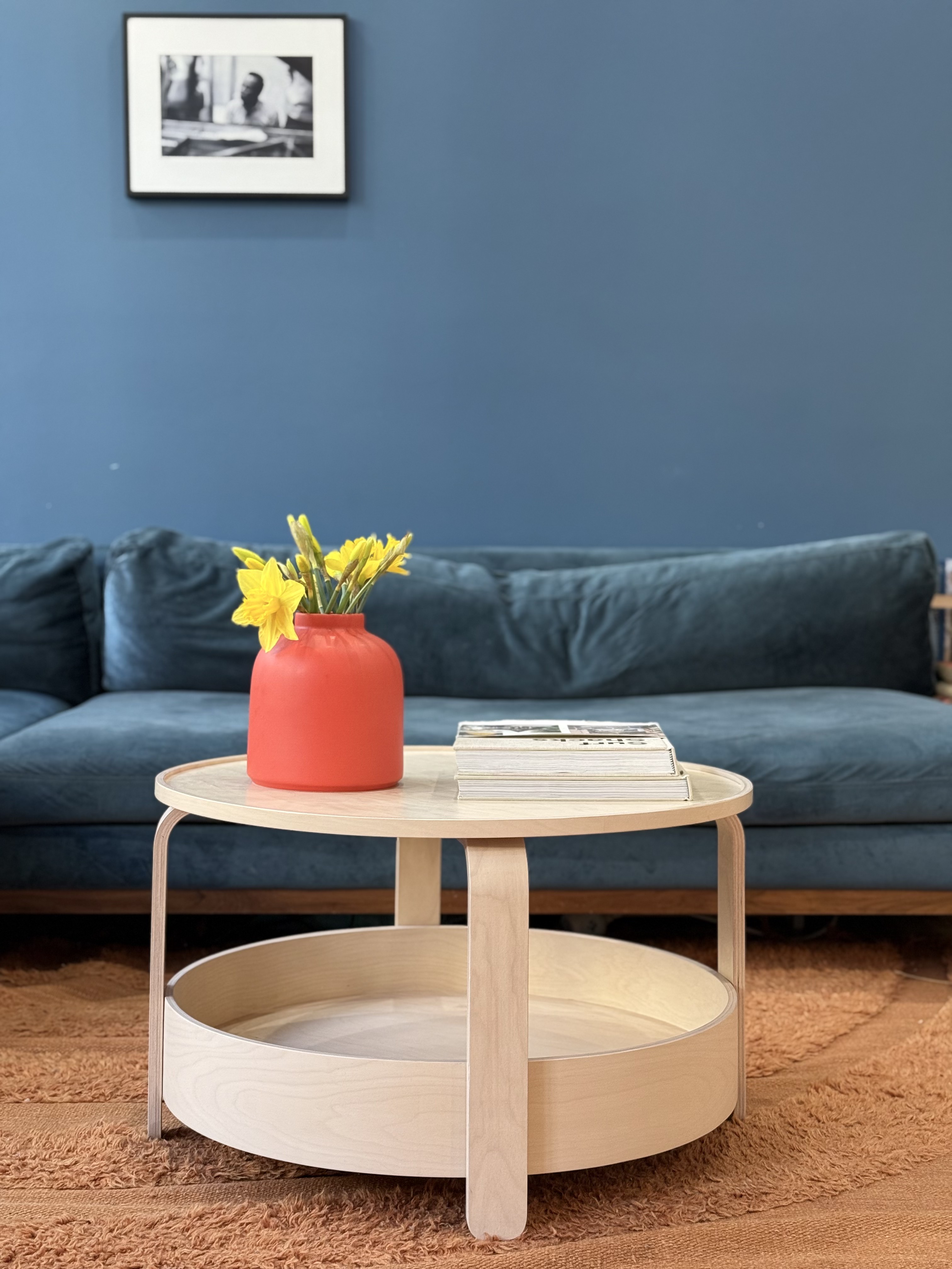 Blue velvet sofa with coffee table